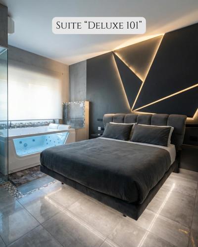 a bedroom with a bed and a bath tub at HeySuite Trastevere GuestHouse ROMA in Rome