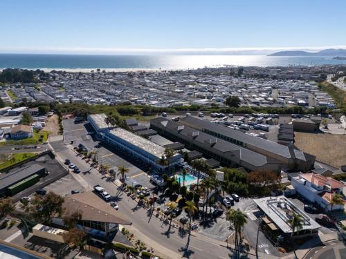 an aerial view of a city with a parking lot at The Grove at Pismo Beach in Pismo Beach