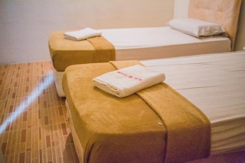 Katil atau katil-katil dalam bilik di Menara One Hotel