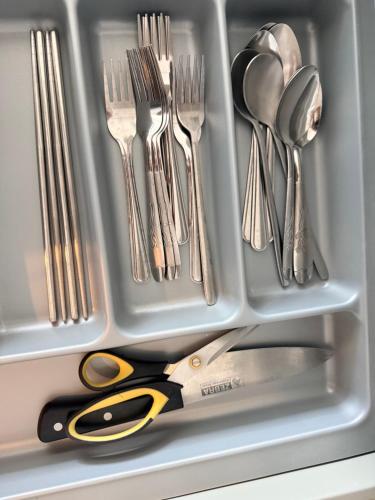 a drawer filled with silverware and forks and spoons at Mega Bangna Studio Retreat in Bang Kew Yai