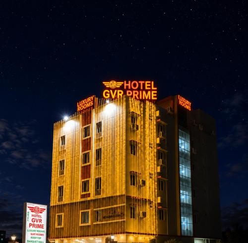 a hotel with a sign on top of a building at Hotel GVR Prime in Guntūr