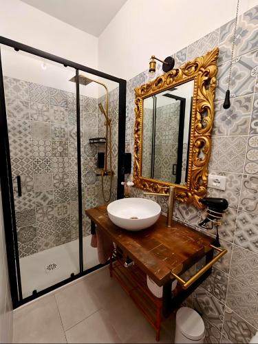 a bathroom with a sink and a mirror at Coramino in Chioggia