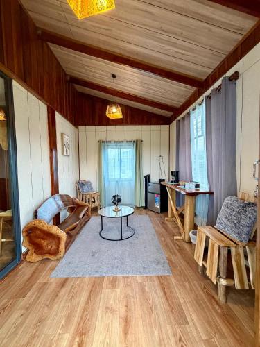 a living room with a table and chairs in it at Kokoro Garden in Fortuna