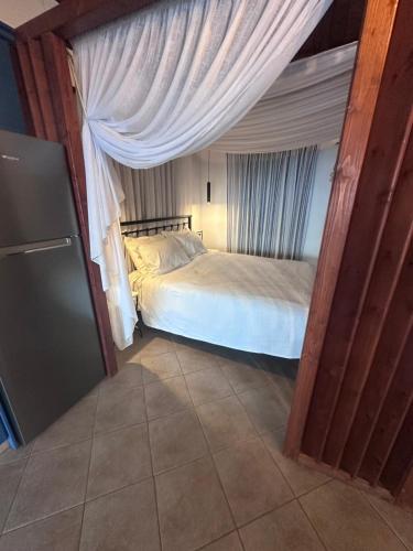 a small bedroom with a bed in a room at Casa Gaia - Unit 1 in Glossa