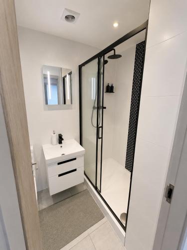 a bathroom with a shower and a white sink at AS Residences in Preston