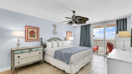 a bedroom with a bed and a ceiling fan at Romar Tower 6B in Orange Beach