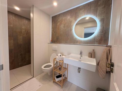 a bathroom with a sink and a toilet at Manor 2 in Stará Lesná