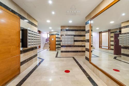 a dressing room with wood and tile walls at Hanami Suite in Lloret de Mar