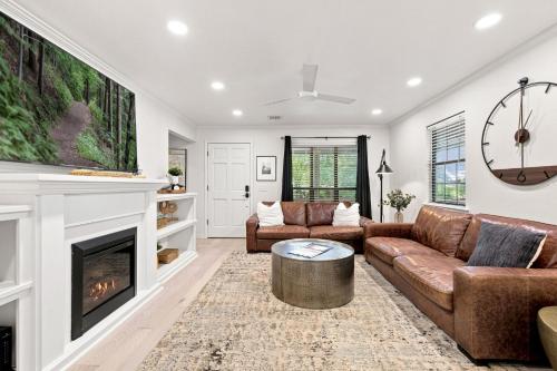 a living room with a couch and a fireplace at Gravity Getaway in Bella Vista