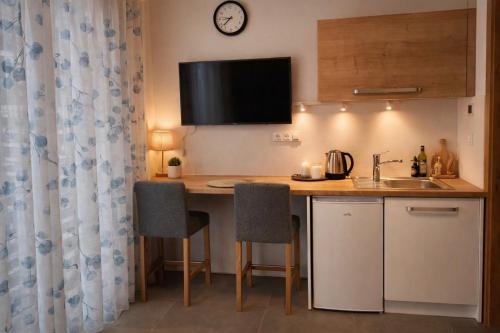 a kitchen with a counter with a sink and a counter top at Studio U Karolíny Nová Pec in Nová Pec