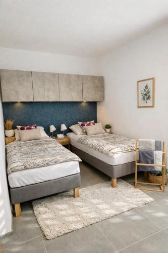 a bedroom with two beds in a room at Studio U Karolíny Nová Pec in Nová Pec