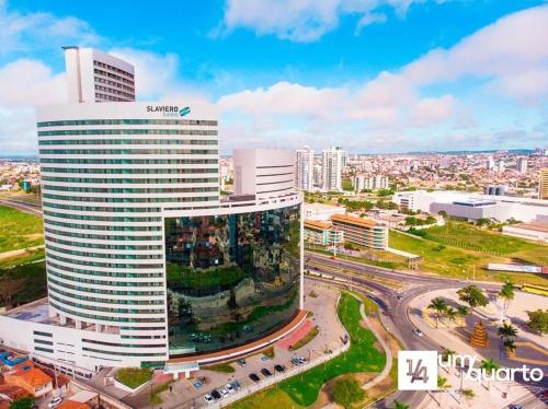 a samsung building in a city with cars at Heron Marinho Flats in Campina Grande