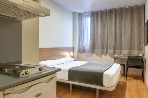 Voodi või voodid majutusasutuse Vértice Roomspace toas