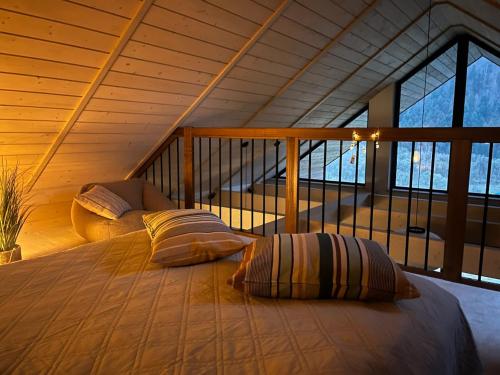a bedroom with a bed with two pillows on it at Furdasówka in Szczawnica