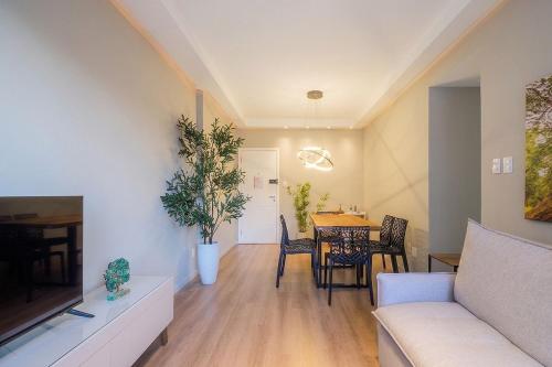 a living room with a couch and a table at Charming apartment in downtown Floripa EDC402 in Florianópolis