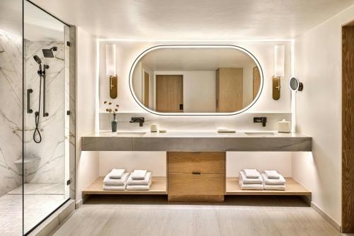 a bathroom with a sink and a mirror at JW Marriott Tucson Starr Pass Resort in Tucson