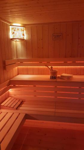 an inside of a sauna with a light on at Captain Pahlen Ferienanlage in Zingst