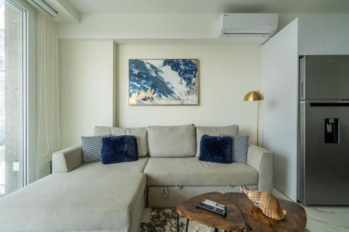 a living room with a couch and a table at Nuevo Vallarta Peaceful Loft in Nuevo Vallarta