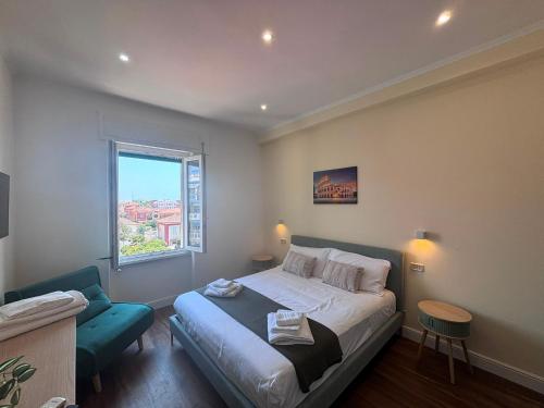 a small bedroom with a bed and a window at Mare di Roma 2 in Lido di Ostia