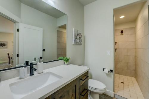 a bathroom with a sink and a toilet and a mirror at Desert Oasis in Washington