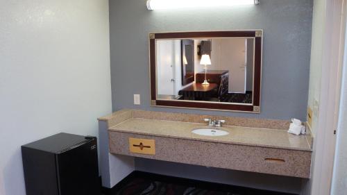 a bathroom with a sink and a mirror at Riverview Inn in North Fort Myers