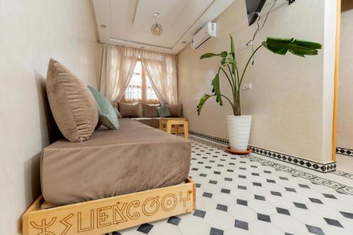 a bedroom with a bed in a room with a floor at KASA GUEST Tamraght in Tamraght Ouzdar