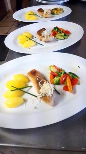 a couple of plates of food on a table at Hotel-Cafe Rathaus in Bad Abbach