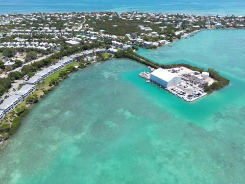 an aerial view of a resort in the water at Crystal Waters - 2BR 2-5BA Coastal Villa in Duck Key
