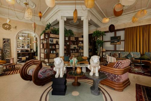 a living room with a couch and a table at Nômade Temple Madrid in Madrid