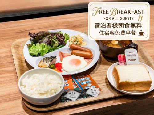 a plate of food with rice and meat and vegetables at Trust Hotel in Hiroshima