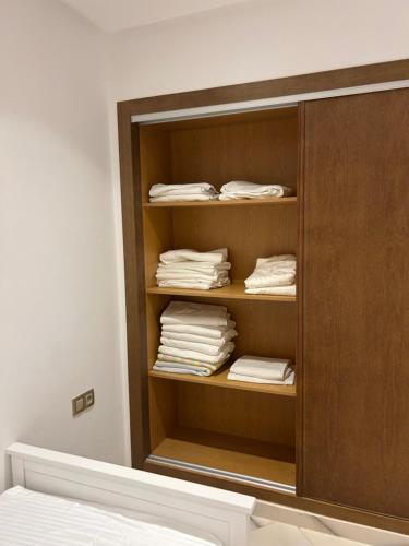 a room with a closet with folded towels at belle appartement à centre Kénitra in Kenitra