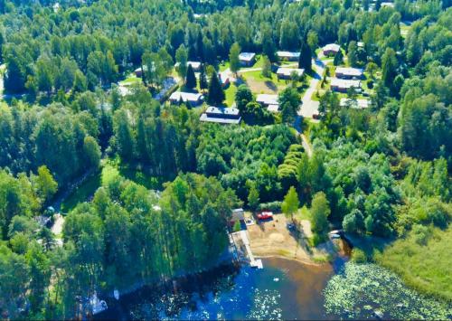 an aerial view of a town with a river and trees at Ventum Village in Punkaharju
