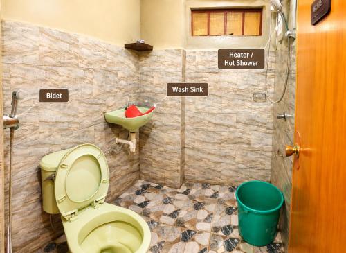 a bathroom with a toilet and a sink at Acai's Transient House in Sagada