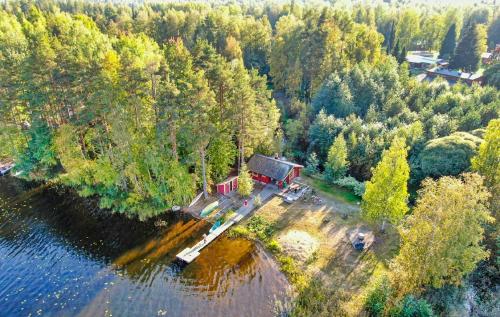an aerial view of a house on an island in the water at Ventum Village in Punkaharju