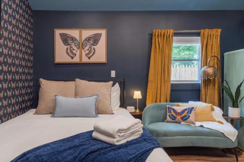 a bedroom with a bed and a chair at Soft Launch Deal Butterfly Bungalow Studio in Saugerties
