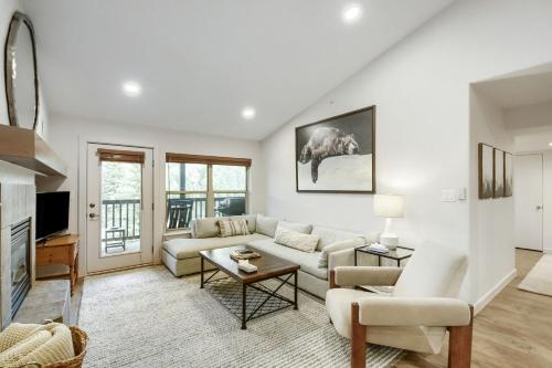 a living room with a couch and a tv at River Pines A303 condo in Edwards