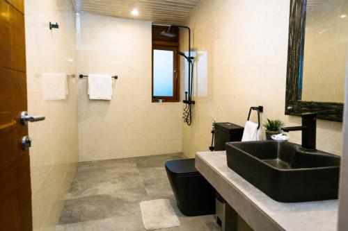 a bathroom with a sink and a toilet at Hillcrest Ella in Ella