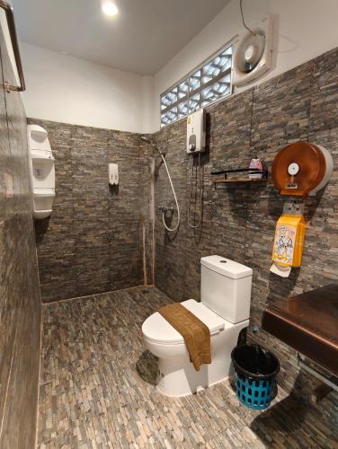 a bathroom with a toilet and a shower at Ban Tai Resort in Ban Tai
