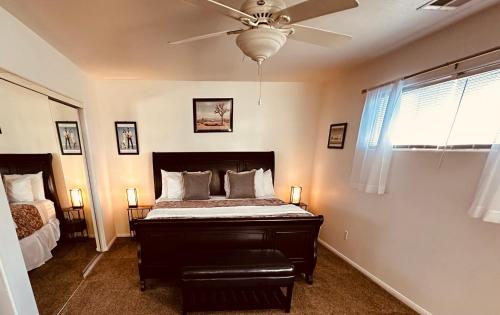 a bedroom with a bed and a ceiling fan at Desert Vista View in Desert Hot Springs