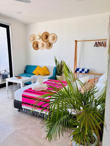a bedroom with a bed and a potted plant at Studio RoofTop with amazing view in Mahahual