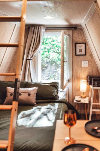 a bedroom with a bunk bed and a window at Romantic A-Frame Couples Retreat Cozy and 12 Acres in Rockbridge