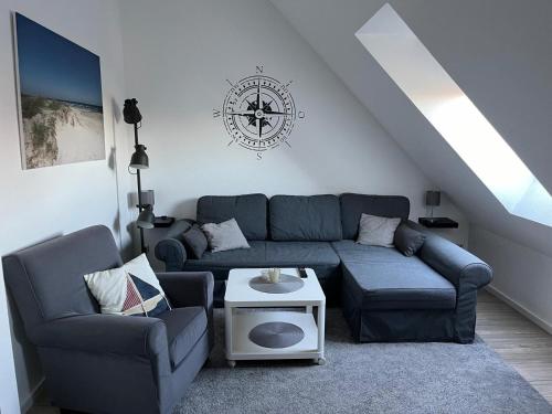 a living room with a couch and a table at App "Ahoi" Familie Köhn in Schönberger Strand