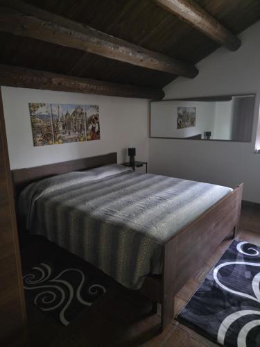 a bedroom with a large bed in a room at La Dimora del Grifo in Mascalucia