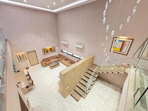 a view of a room with a staircase and a stair case at Manav Farmhouse in Olpād