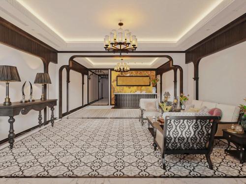 a living room with a couch and a chandelier at LA Resident IndoChine Hotel in Vientiane