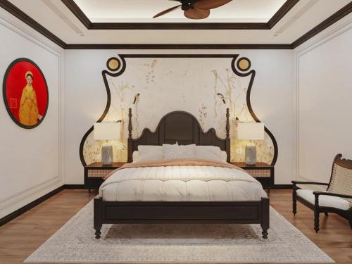 a bedroom with a large bed and a painting on the wall at LA Resident IndoChine Hotel in Vientiane
