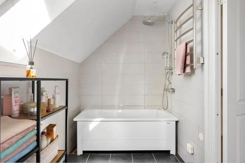 a bathroom with a white tub in a room at Villa in Skurup in Skurup