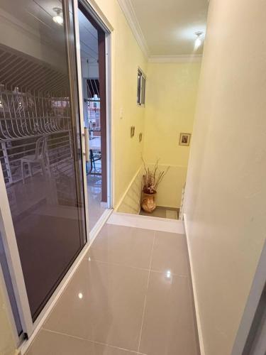 a hallway with a glass door leading to a patio at Casa brisa del caribe in Juan López