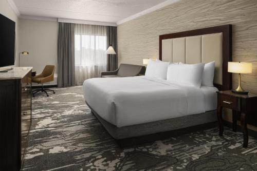 a large white bed in a hotel room at Doubletree by Hilton, Leominster in Leominster
