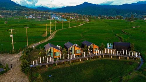 an aerial view of a house in a field at The field@pua เดอะฟิลด์แอทปัว in Pua